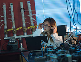 A student doing an experiment. Links to Donor-Advised Funds